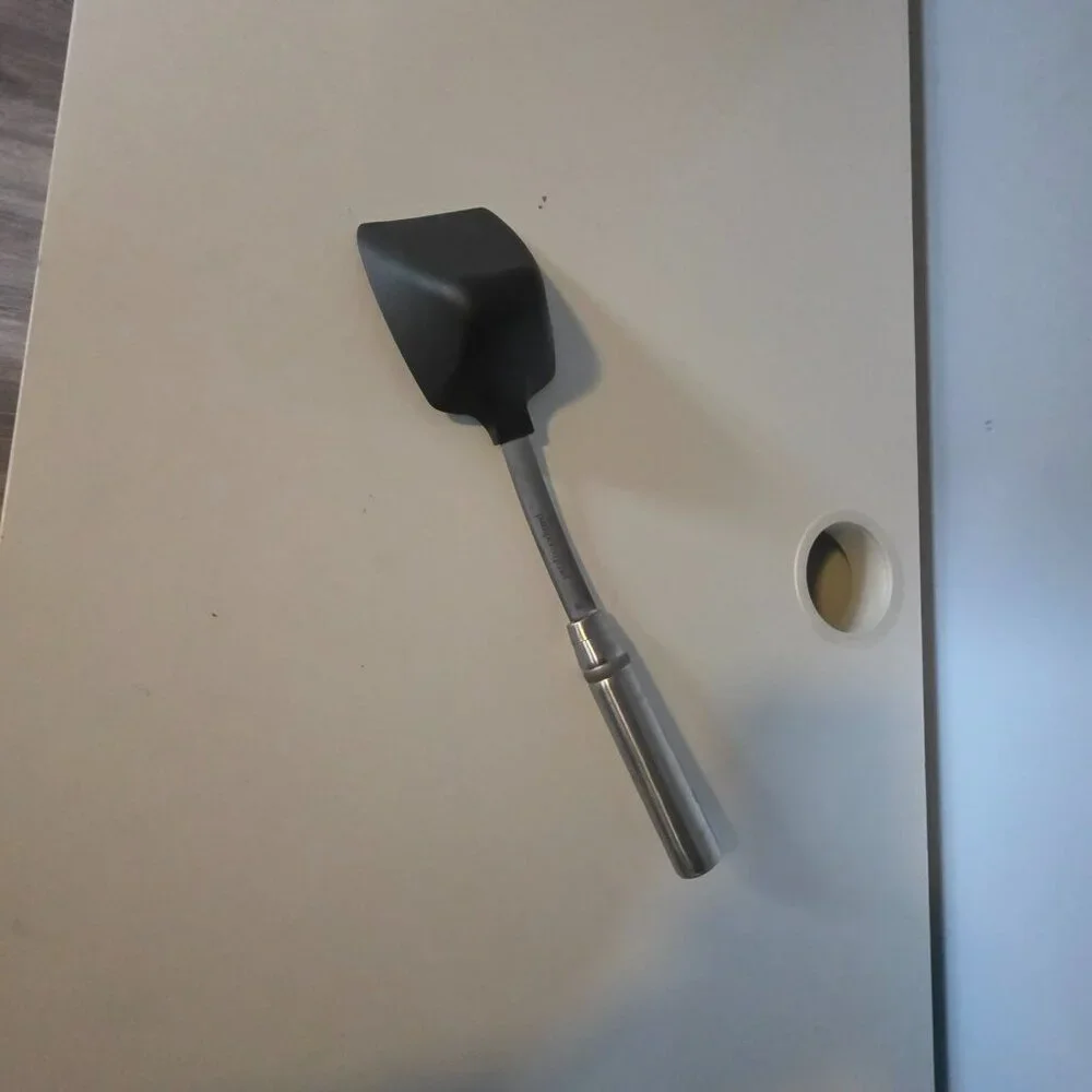 The item in your image is the Pampered Chef Scoop & Serve Spatula (Item #100286)